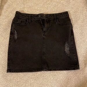 Distressed black jean mini skirt